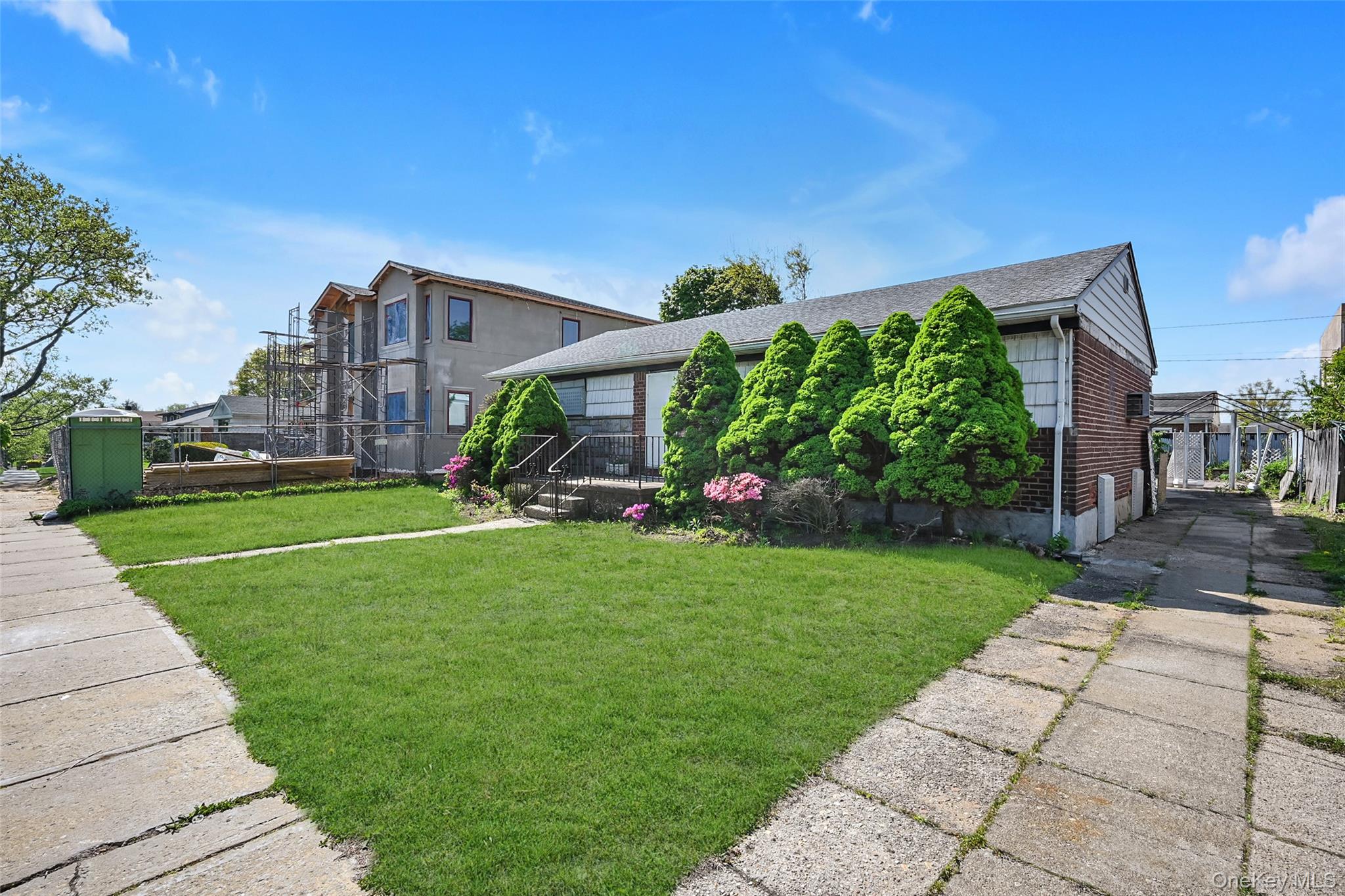 2255 Parkhurst Road Elmont, NY 11003 - Photo 20 of 24 a view of a house with a back yard
