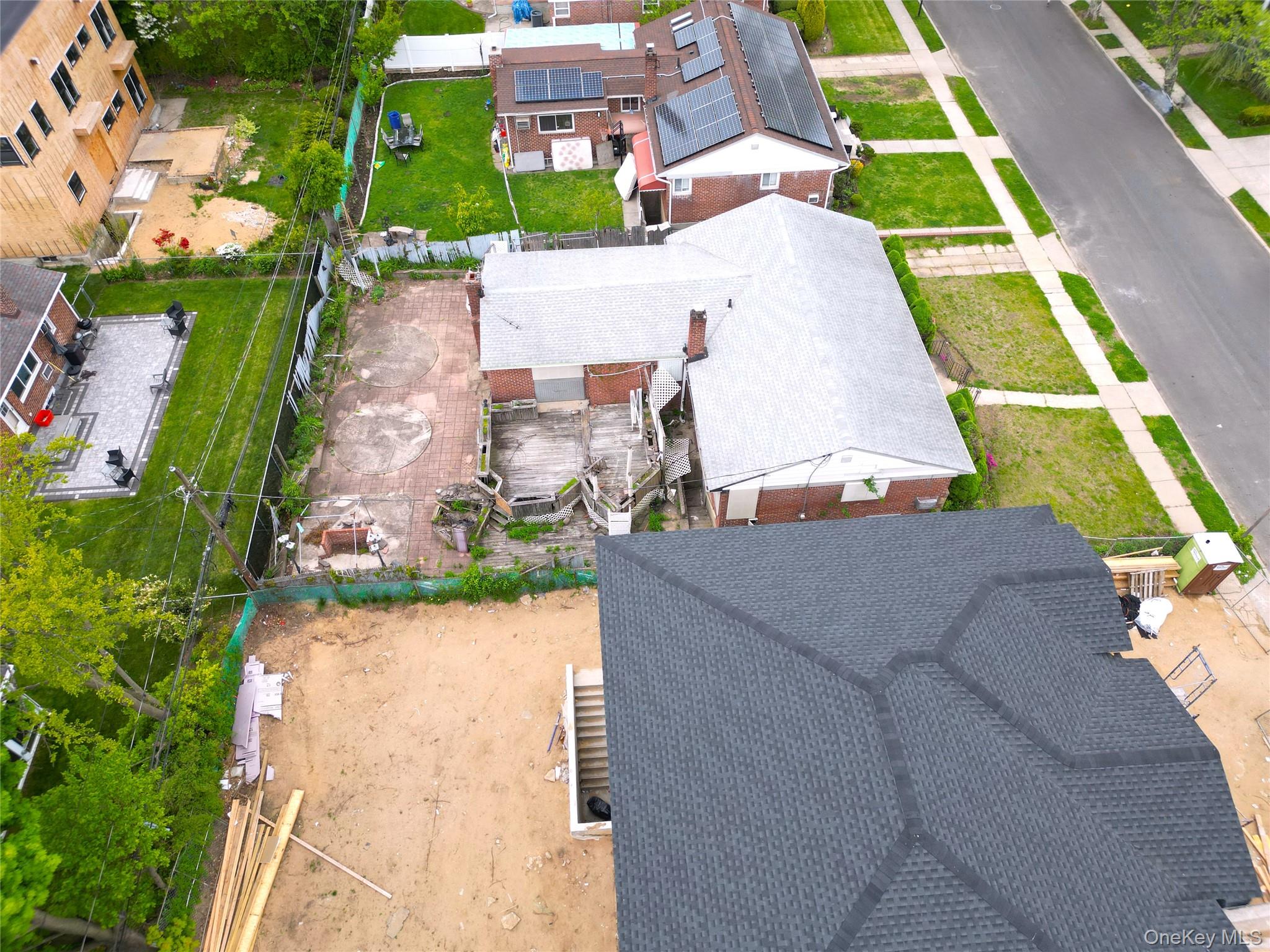 2255 Parkhurst Road Elmont, NY 11003 - Photo 23 of 24 an aerial view of a house with a yard and potted plants