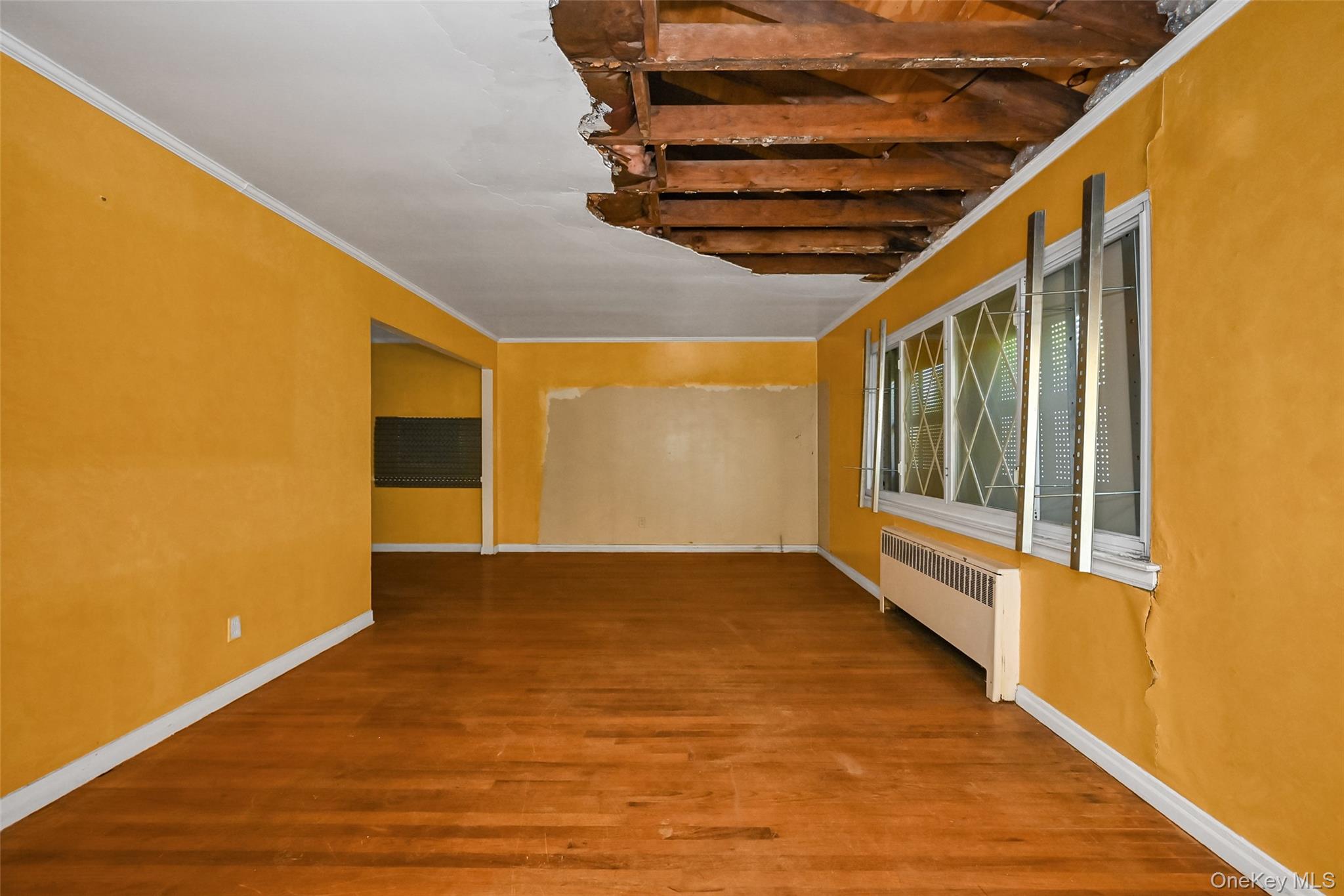 2255 Parkhurst Road Elmont, NY 11003 - Photo 4 of 24 a view of an empty room with a window