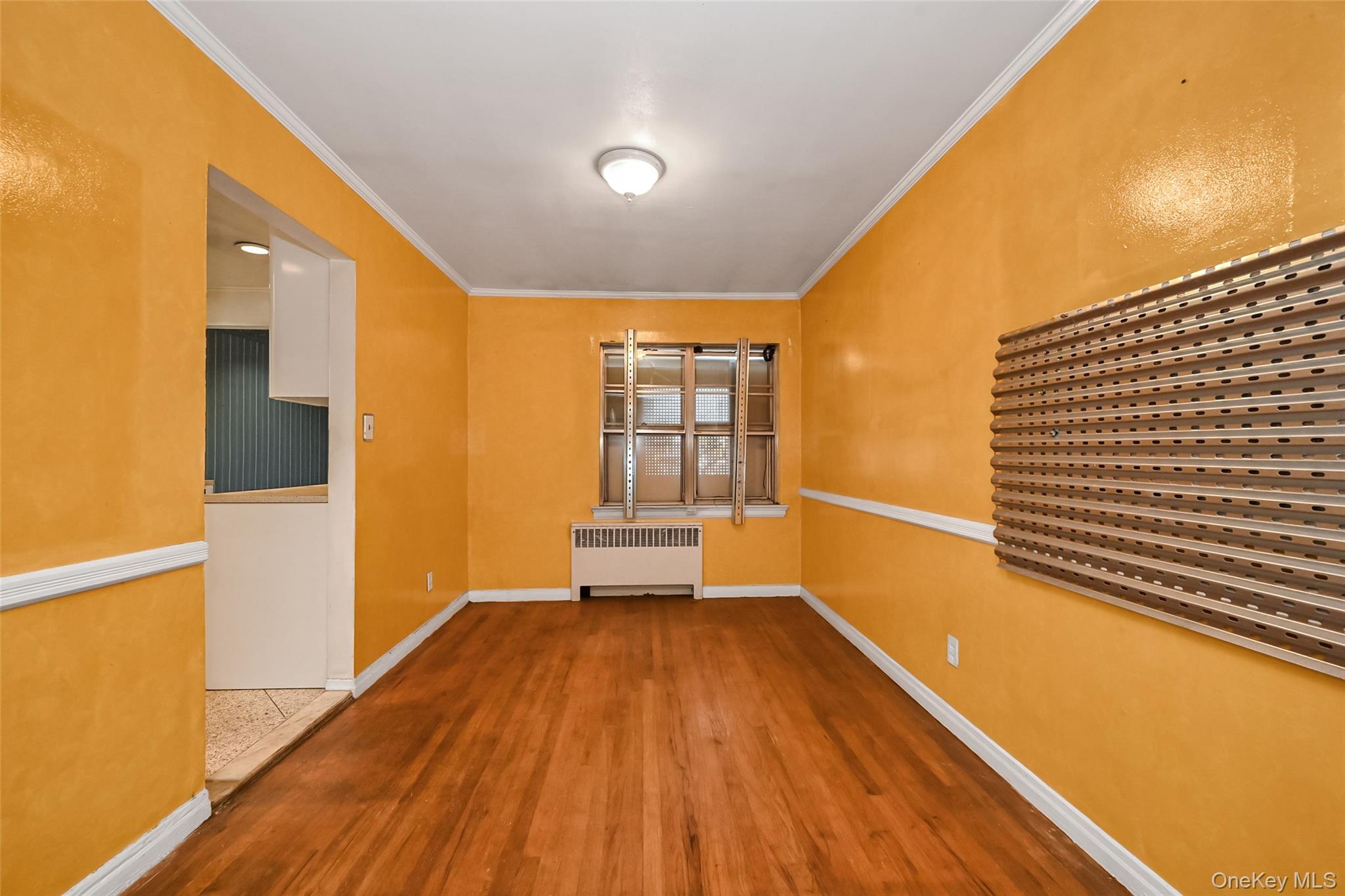 2255 Parkhurst Road Elmont, NY 11003 - Photo 5 of 24 a view of a room with wooden floor and windows