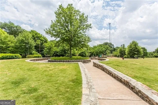 a view of a swimming pool with a yard