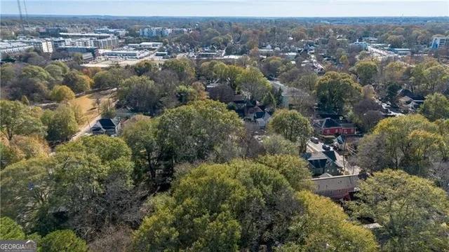 a view of a water fountain with large trees