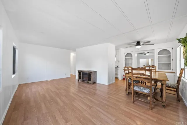 a living room with furniture a fireplace and a table