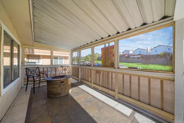 a balcony with chairs and outdoor space