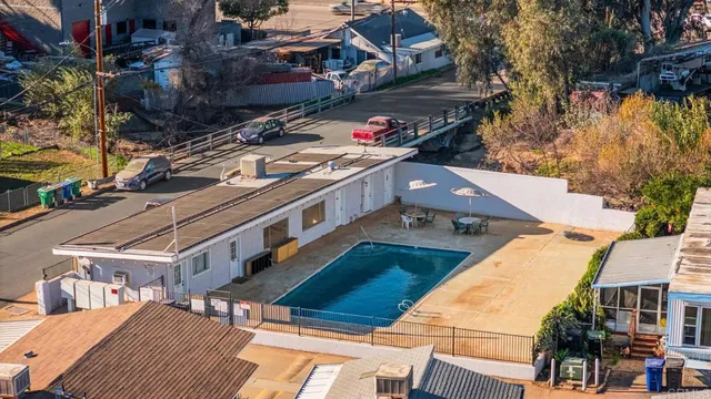 a aerial view of a house with a yard