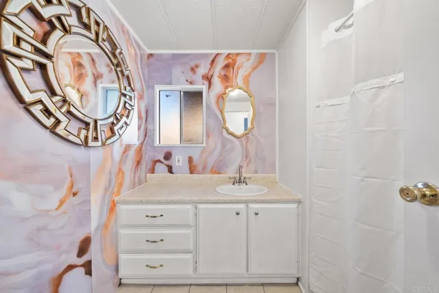 a bathroom with a sink and a mirror