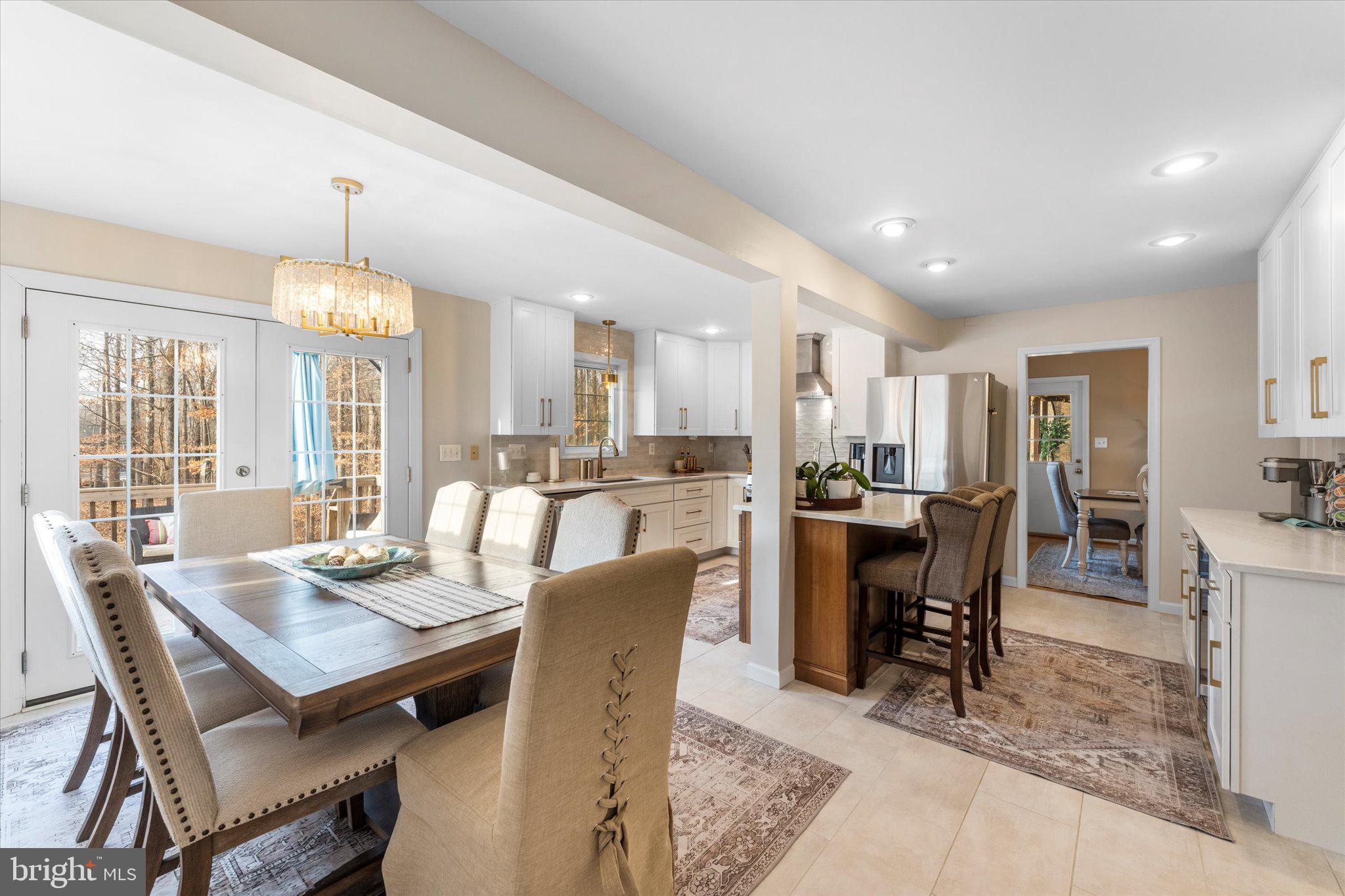 8015 Stillbrooke Road Manassas, VA 20112 - Photo 13 of 34 a view of a dining room with furniture