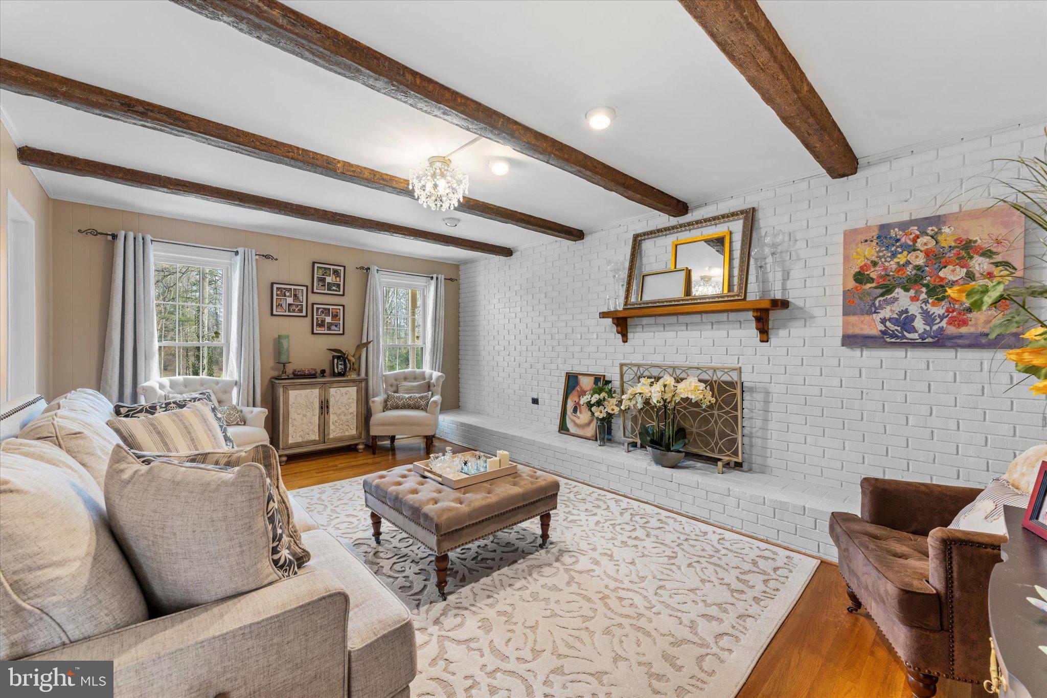 8015 Stillbrooke Road Manassas, VA 20112 - Photo 16 of 34 a living room with furniture and a flat screen tv