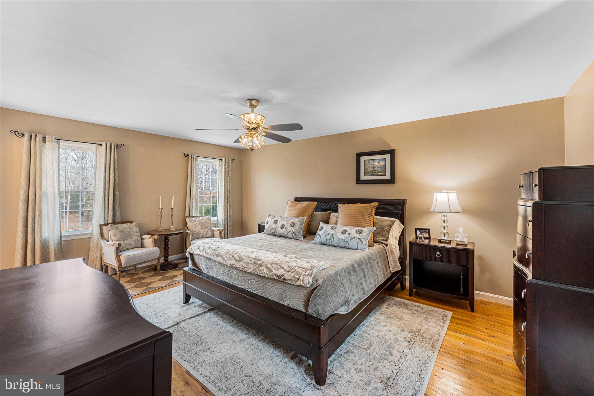 8015 Stillbrooke Road Manassas, VA 20112 - Photo 20 of 34 a bedroom with a bed and a couch