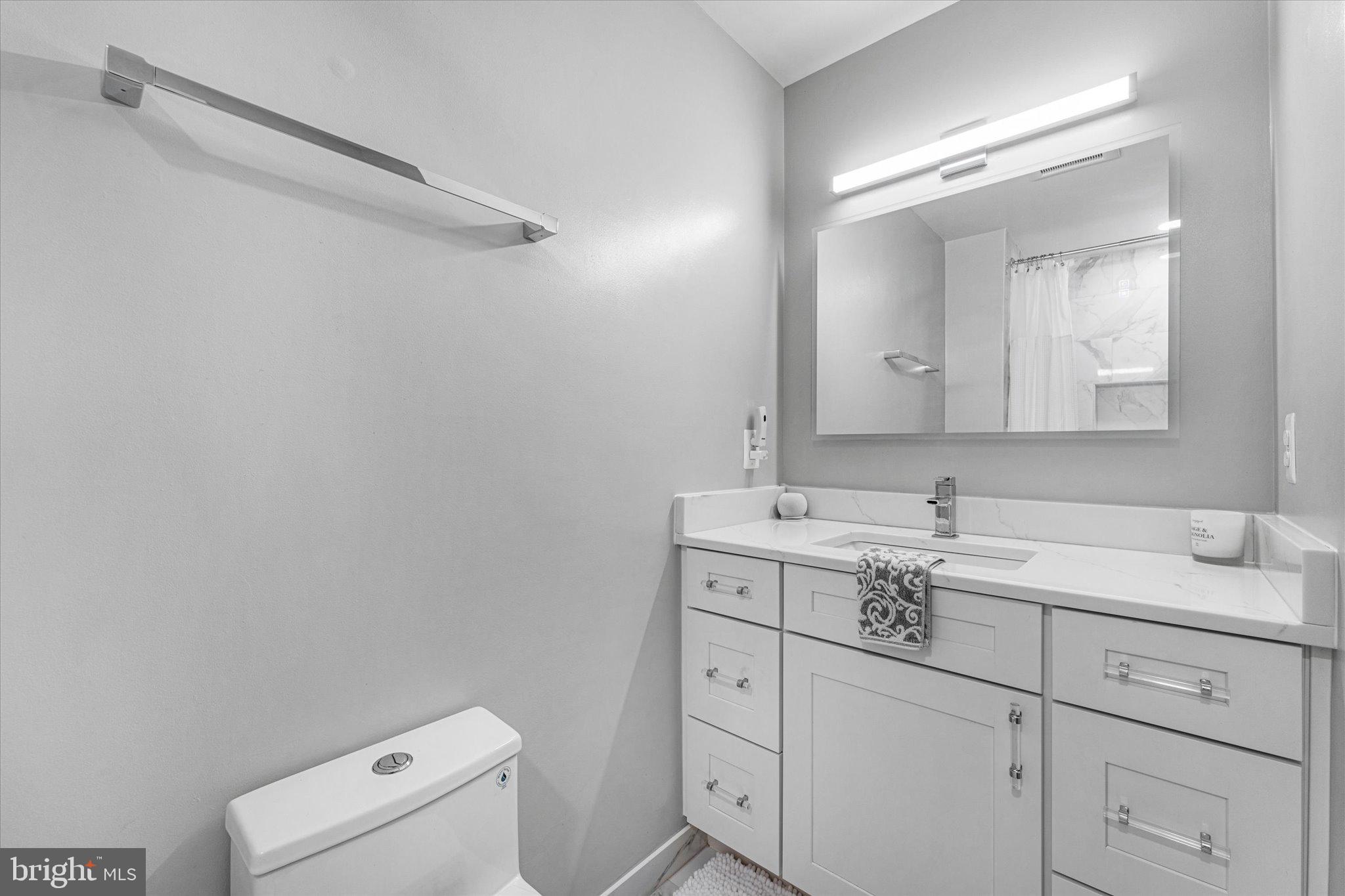 8015 Stillbrooke Road Manassas, VA 20112 - Photo 23 of 34 a bathroom with a sink vanity and mirror