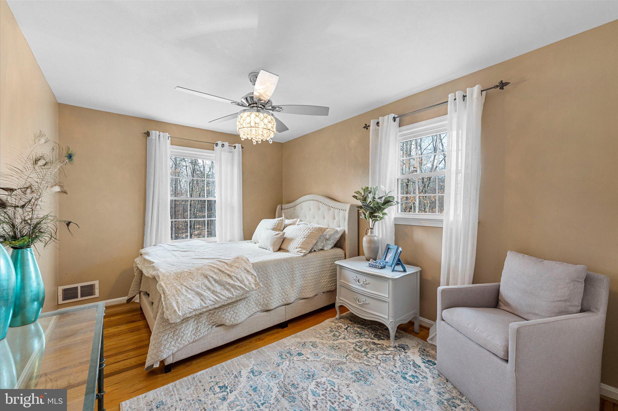 8015 Stillbrooke Road Manassas, VA 20112 - Photo 25 of 34 a living room with a bed furniture and a window