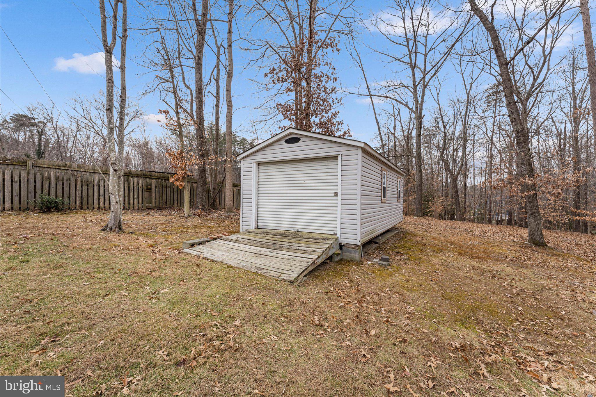 8015 Stillbrooke Road Manassas, VA 20112 - Photo 28 of 34 a front view of a house with a yard