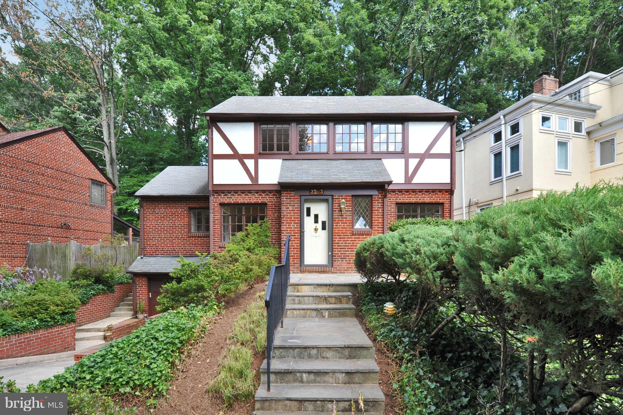 3203 Russell Road Alexandria, VA 22305 - Photo 1 of 30 a front view of a house with a yard