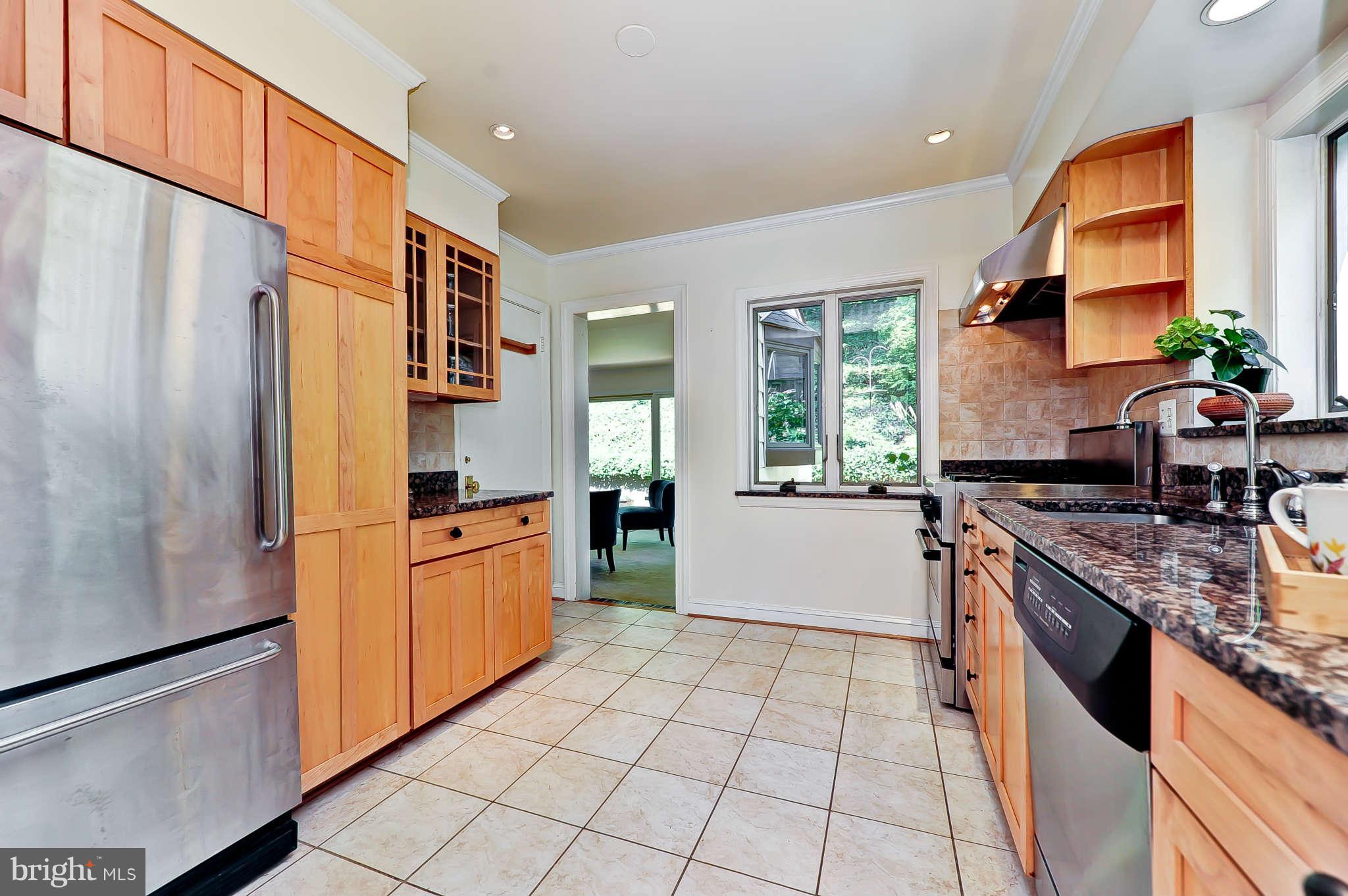 3203 Russell Road Alexandria, VA 22305 - Photo 11 of 30 a kitchen with stainless steel appliances granite countertop a refrigerator a stove and a sink