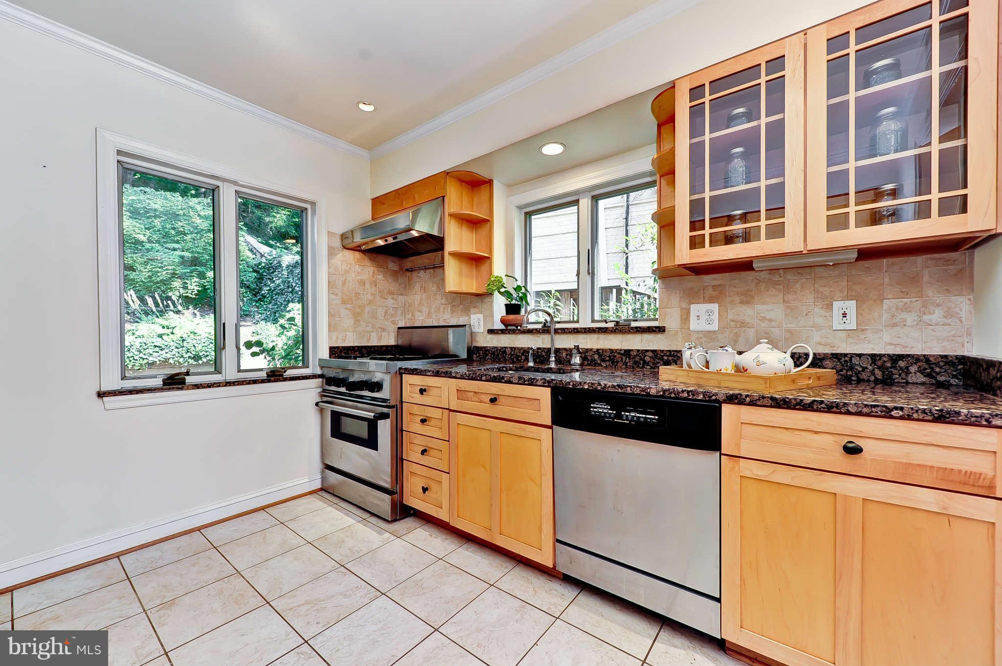 3203 Russell Road Alexandria, VA 22305 - Photo 12 of 30 a kitchen with stainless steel appliances granite countertop a stove and a sink