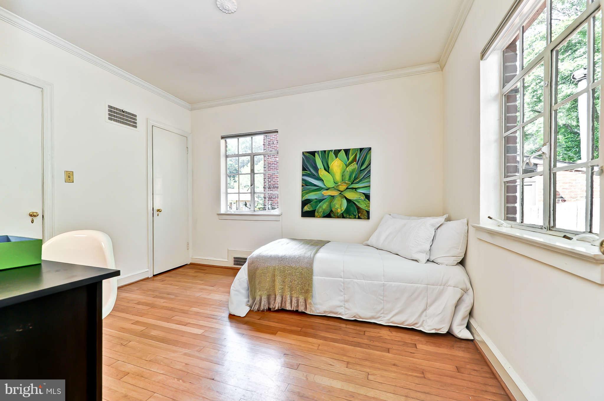 3203 Russell Road Alexandria, VA 22305 - Photo 22 of 30 a bedroom with a bed and a window
