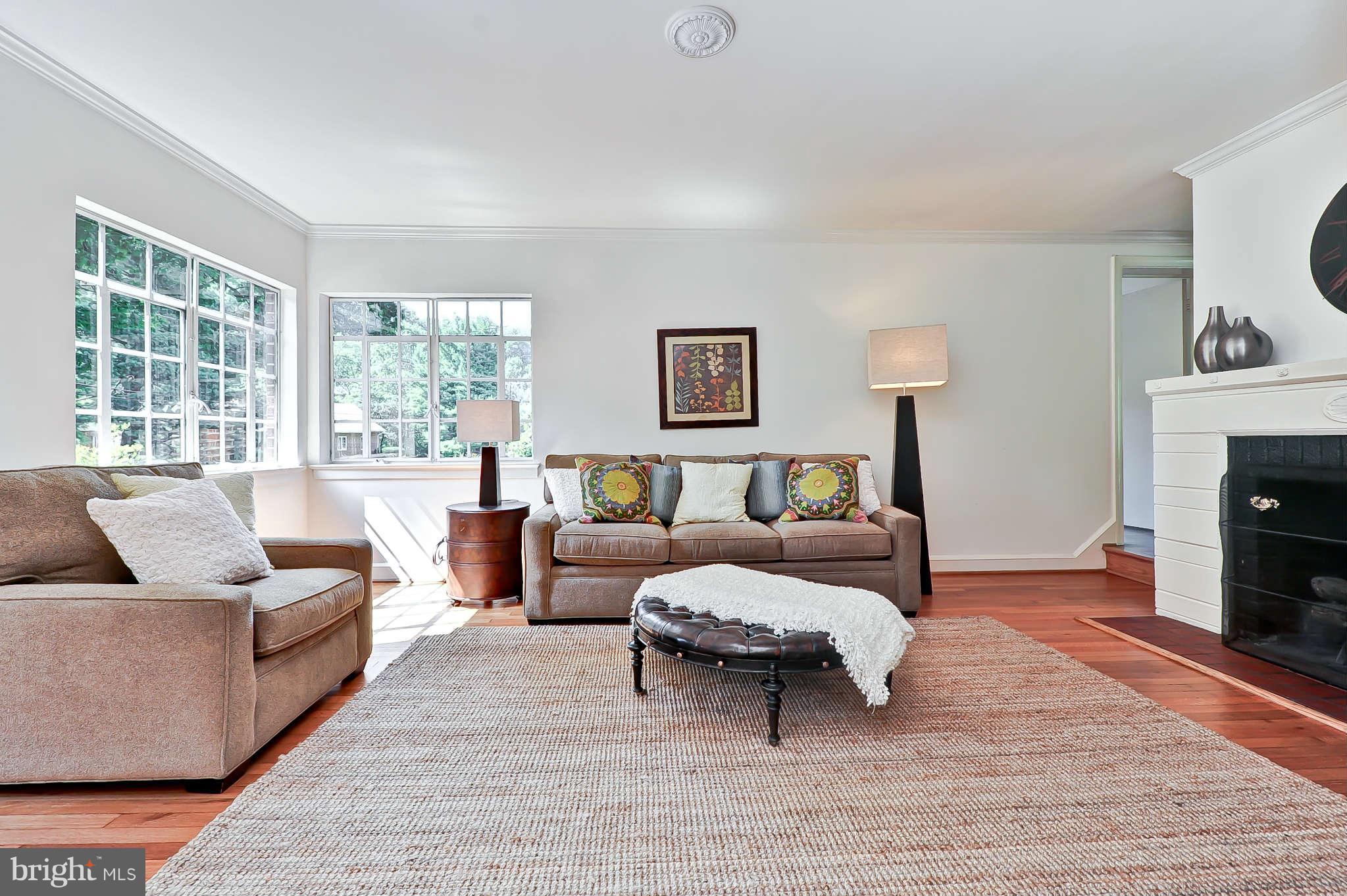 3203 Russell Road Alexandria, VA 22305 - Photo 6 of 30 a living room with furniture and a fireplace
