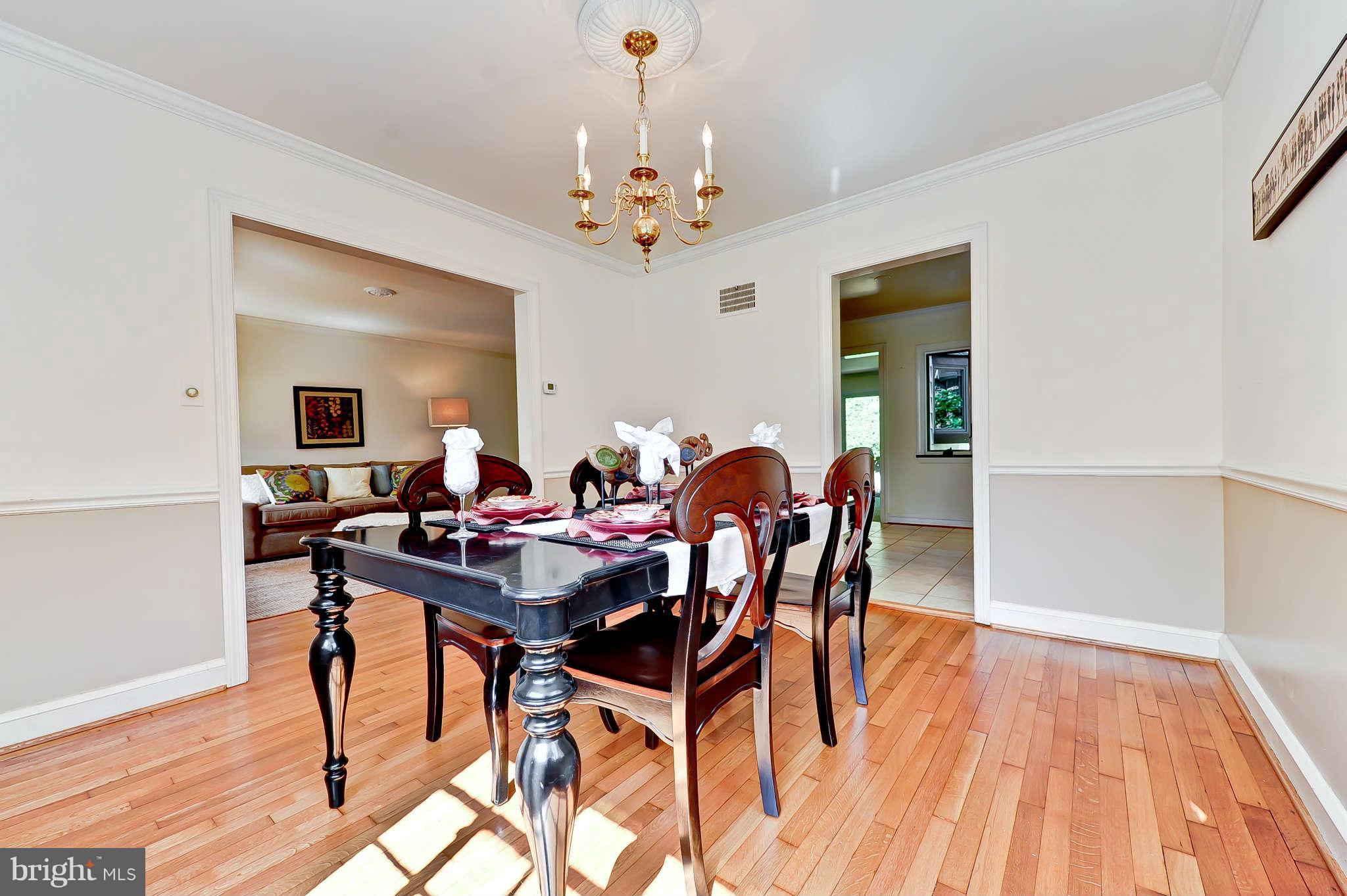 3203 Russell Road Alexandria, VA 22305 - Photo 10 of 30 a view of a dining room with furniture and wooden floor