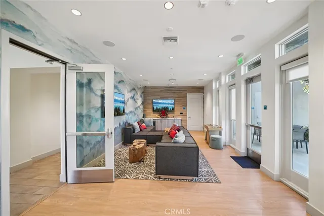 a large kitchen with a large counter top furniture and stainless steel appliances