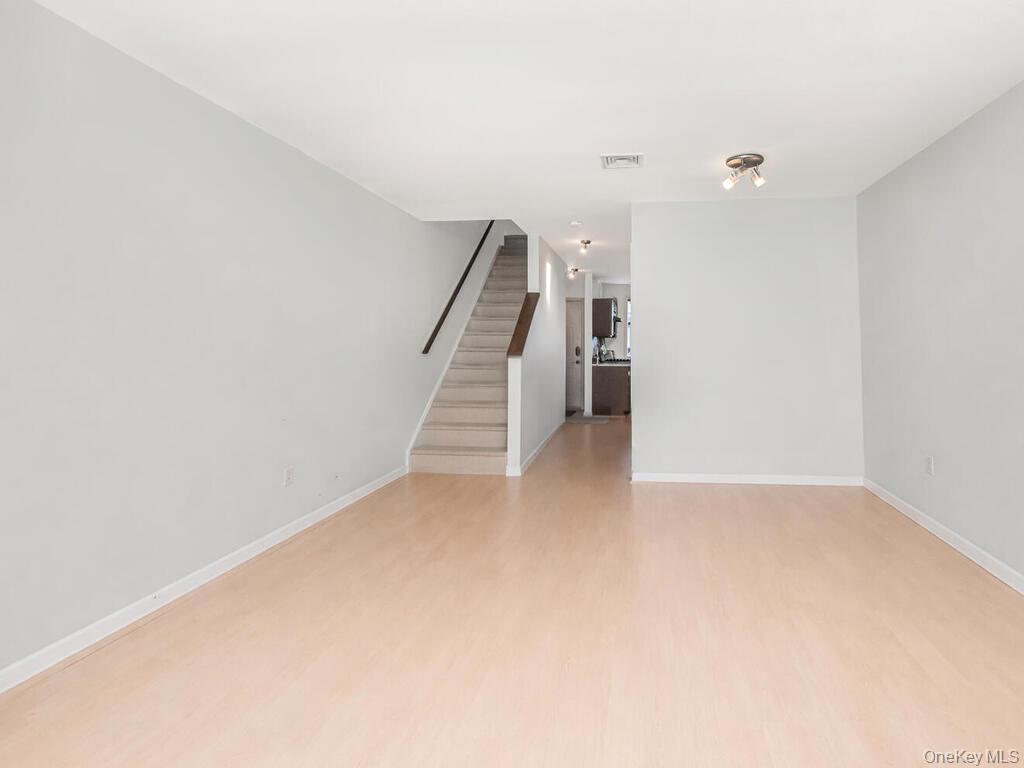 8 Davids Lane Ossining, NY 10562 - Photo 10 of 27 ** Virtually Cleared** Unfurnished living room with recessed lighting