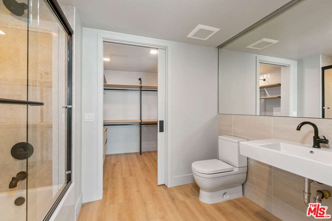 12431 Rochester Avenue, Unit 311 Los Angeles, CA 90025 - Photo 12 of 30 a bathroom with a toilet and a sink