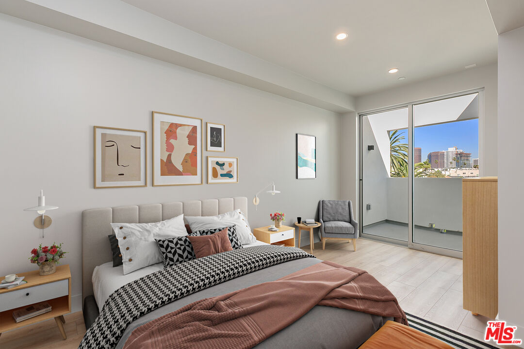 12431 Rochester Avenue, Unit 311 Los Angeles, CA 90025 - Photo 10 of 30 a bedroom with a bed and furniture