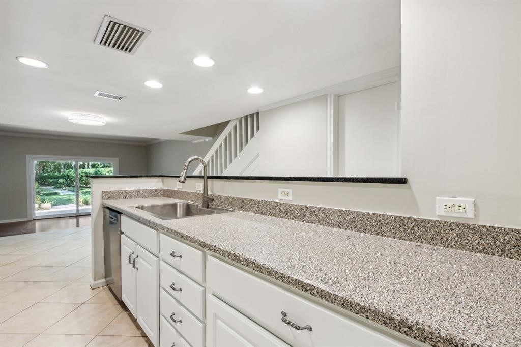 3036 Sea Marsh Road Fernandina Beach, FL 32034 - Photo 11 of 43 a kitchen with a sink and cabinets