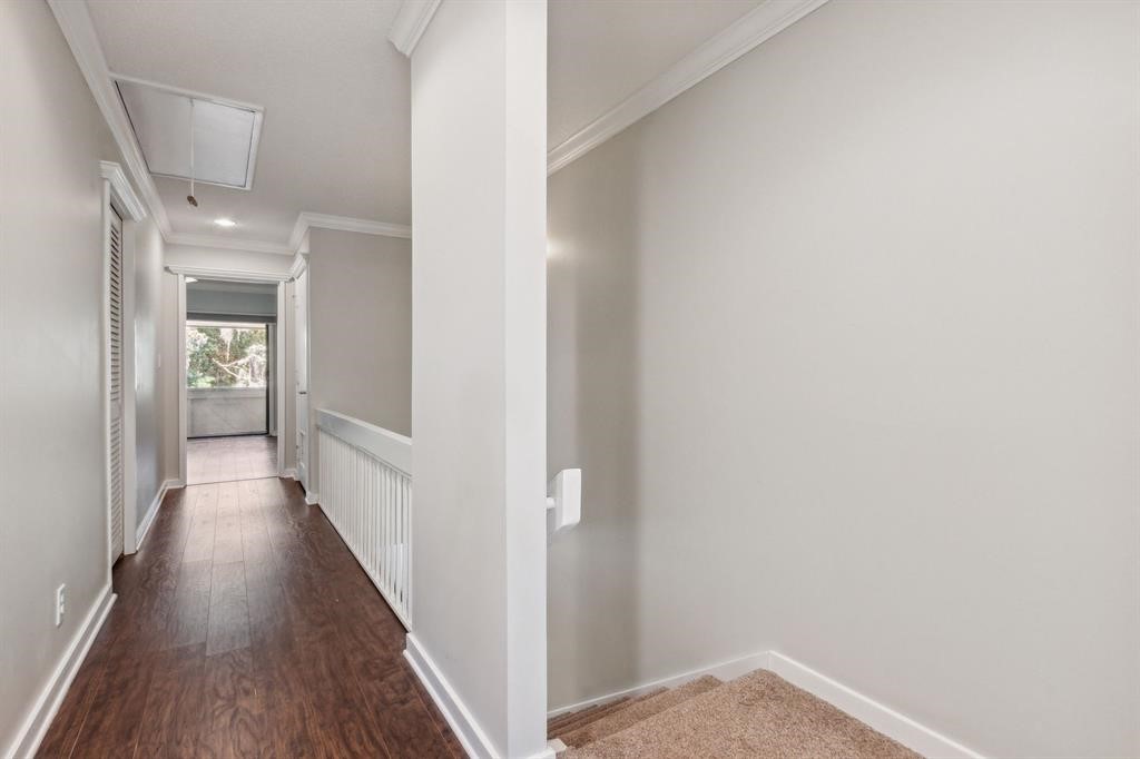 3036 Sea Marsh Road Fernandina Beach, FL 32034 - Photo 17 of 43 a view of a hallway with wooden floor