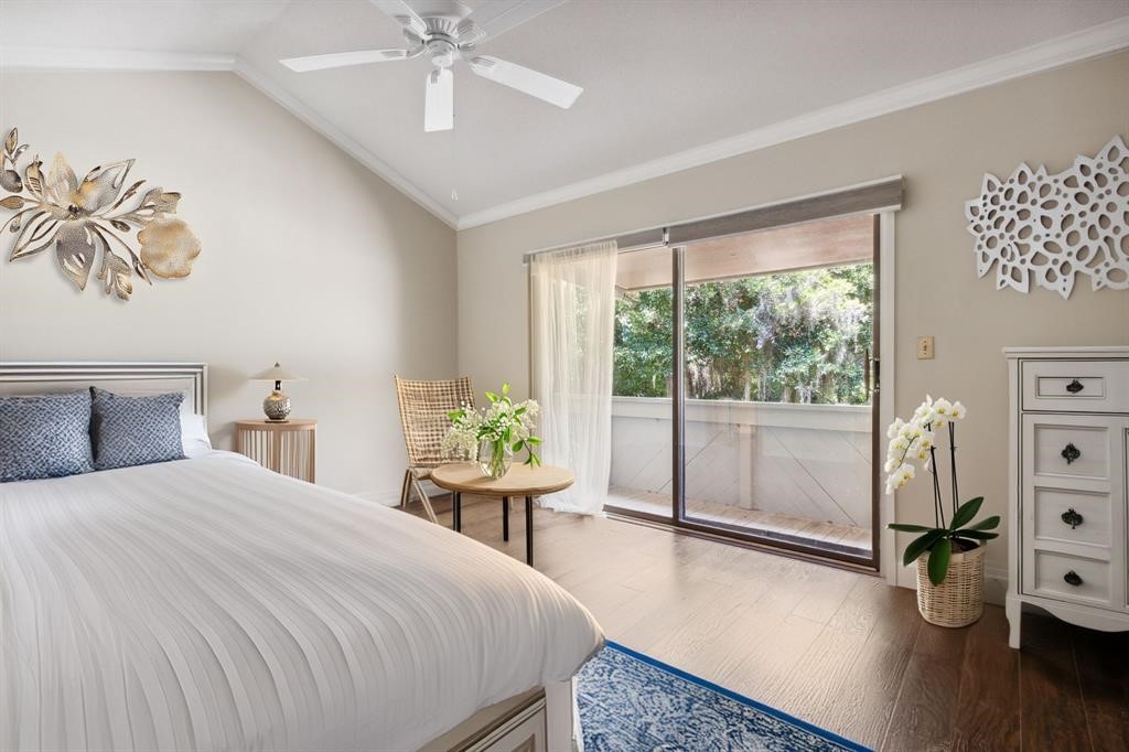 3036 Sea Marsh Road Fernandina Beach, FL 32034 - Photo 18 of 43 a bedroom with a bed and a table in it