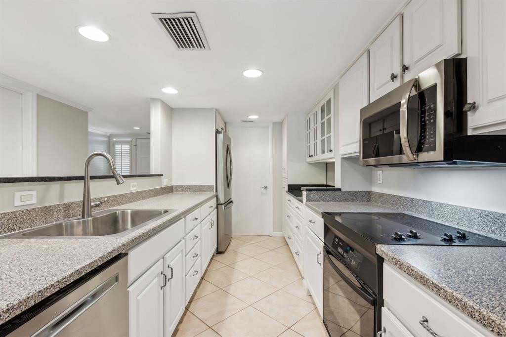 3036 Sea Marsh Road Fernandina Beach, FL 32034 - Photo 2 of 43 a kitchen with stainless steel appliances granite countertop a sink stove and refrigerator