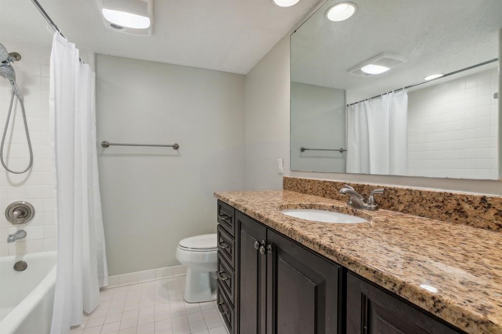 3036 Sea Marsh Road Fernandina Beach, FL 32034 - Photo 23 of 43 a bathroom with a granite countertop sink a toilet and shower