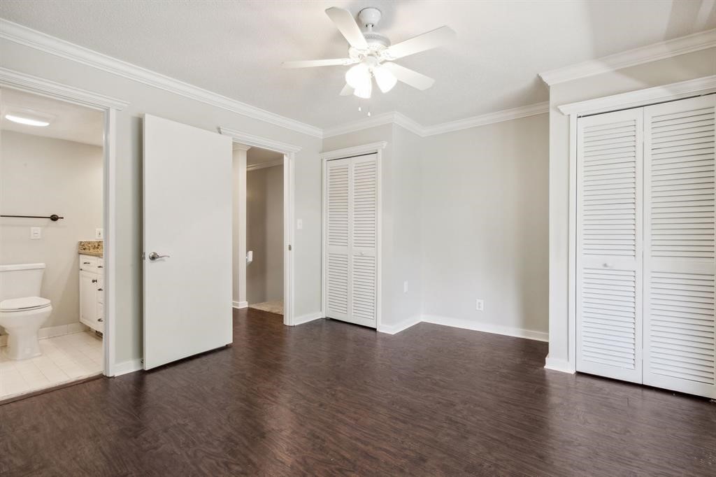 3036 Sea Marsh Road Fernandina Beach, FL 32034 - Photo 27 of 43 an empty room with wooden floor and a ceiling fan