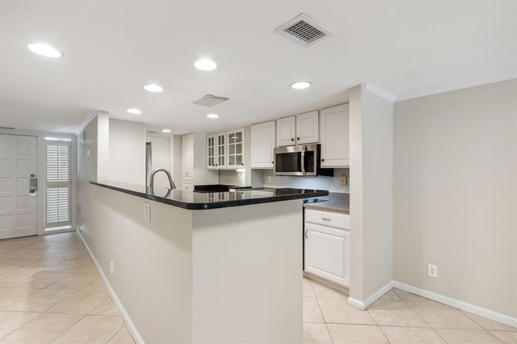 3036 Sea Marsh Road Fernandina Beach, FL 32034 - Photo 7 of 43 a kitchen with stainless steel appliances granite countertop a refrigerator and a sink