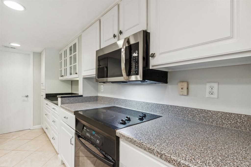3036 Sea Marsh Road Fernandina Beach, FL 32034 - Photo 8 of 43 a kitchen with stainless steel appliances granite countertop a sink stove and microwave