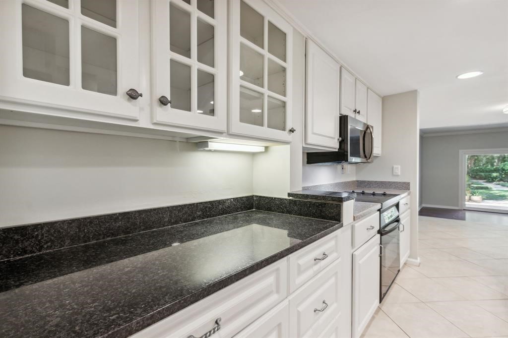3036 Sea Marsh Road Fernandina Beach, FL 32034 - Photo 10 of 43 a kitchen with stainless steel appliances granite countertop a sink and a stove