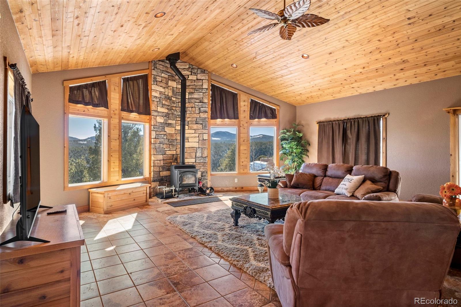 412 Evergreen Road Black Hawk, CO 80422 - Photo 20 of 48 a living room with furniture and large windows
