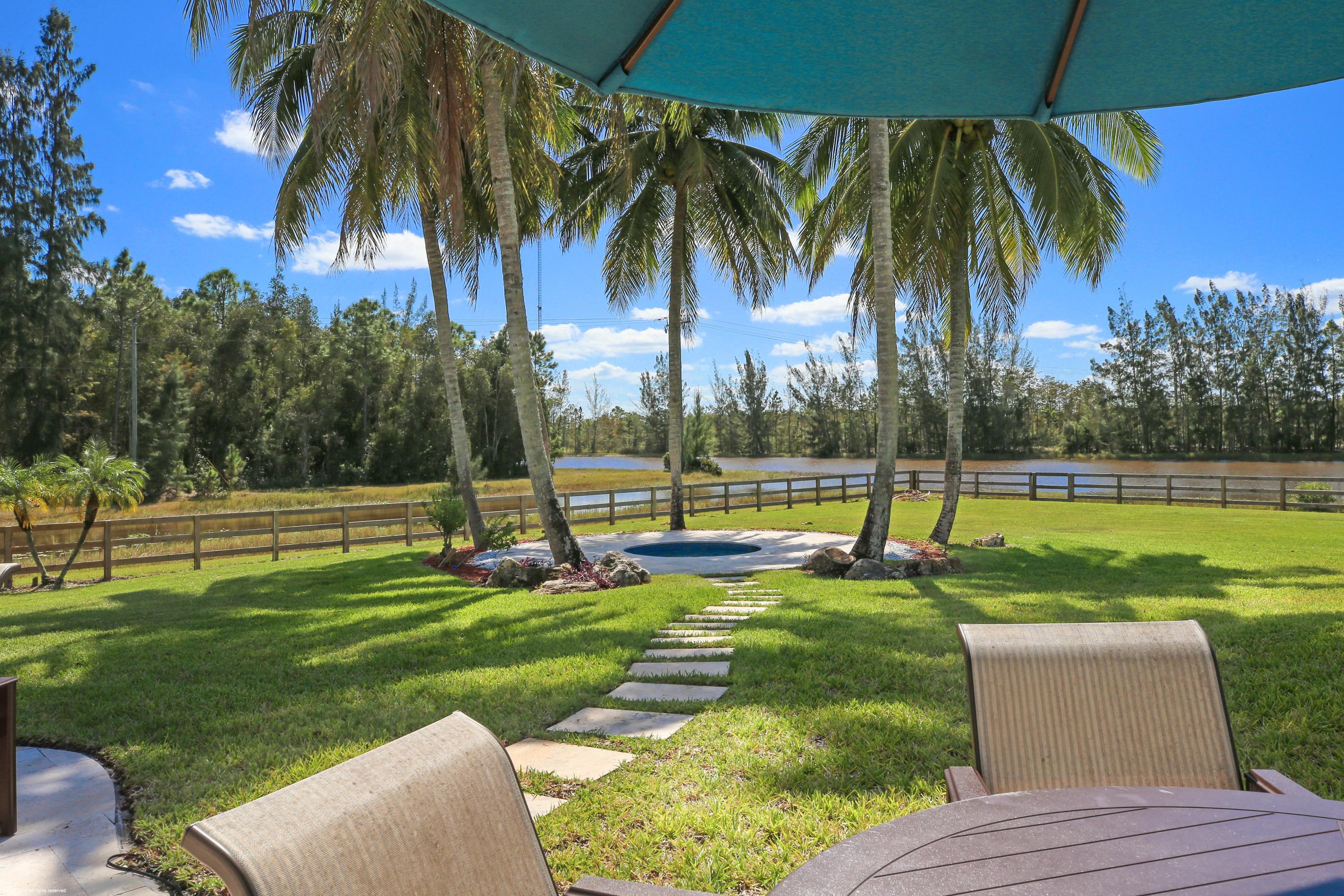 6449 Duckweed Road Lake Worth, FL 33449 - Photo 35 of 49 View from patio to hot tub