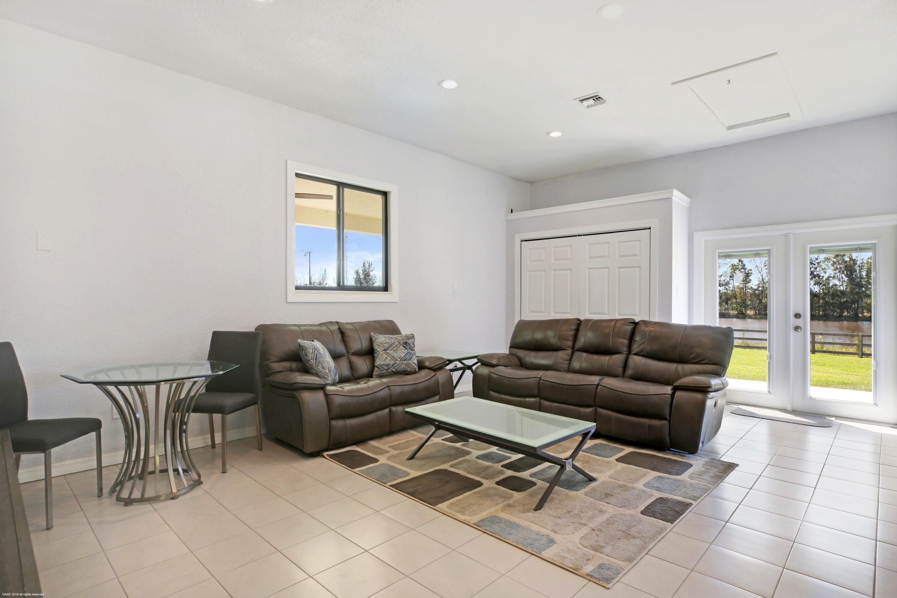 6449 Duckweed Road Lake Worth, FL 33449 - Photo 40 of 49 Guest House Living Room