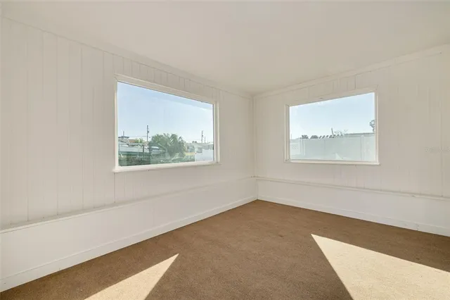 an empty room with windows