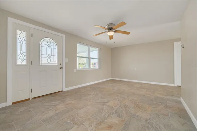 a view of an empty room with a window