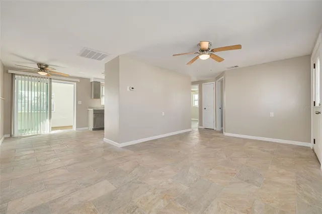 a view of an empty room with a window