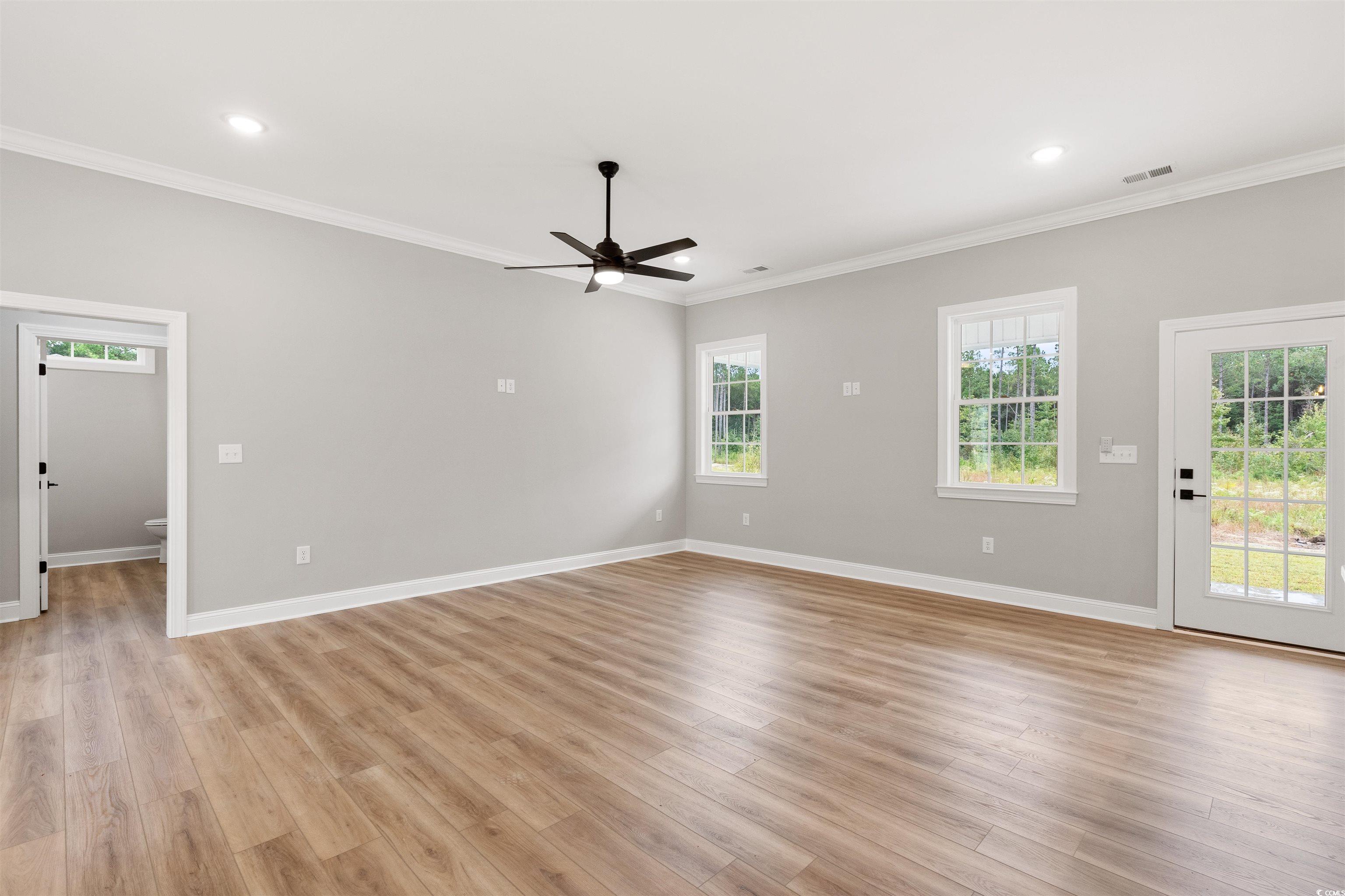 6909 Pauley Swamp Road Conway, SC 29527 - Photo 11 of 40 Unfurnished room with ceiling fan, light wood-type
