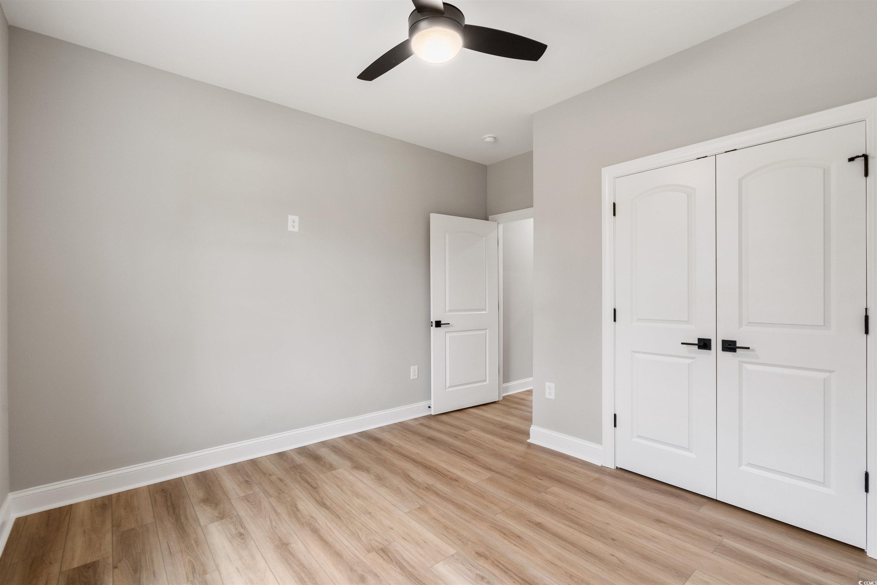6909 Pauley Swamp Road Conway, SC 29527 - Photo 33 of 40 Unfurnished bedroom with light hardwood / wood-sty