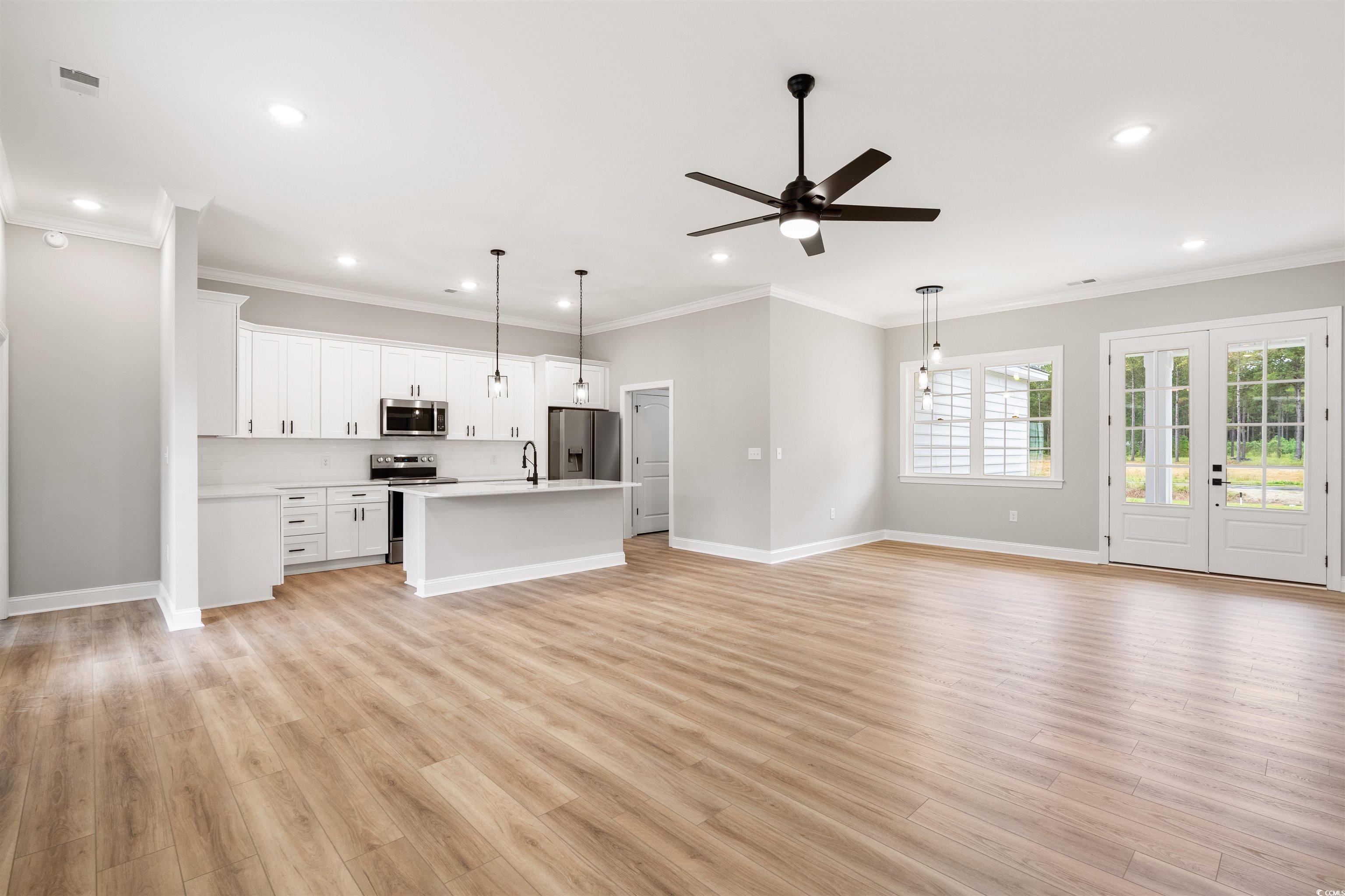 6909 Pauley Swamp Road Conway, SC 29527 - Photo 9 of 40 Kitchen featuring hanging light fixtures, an islan