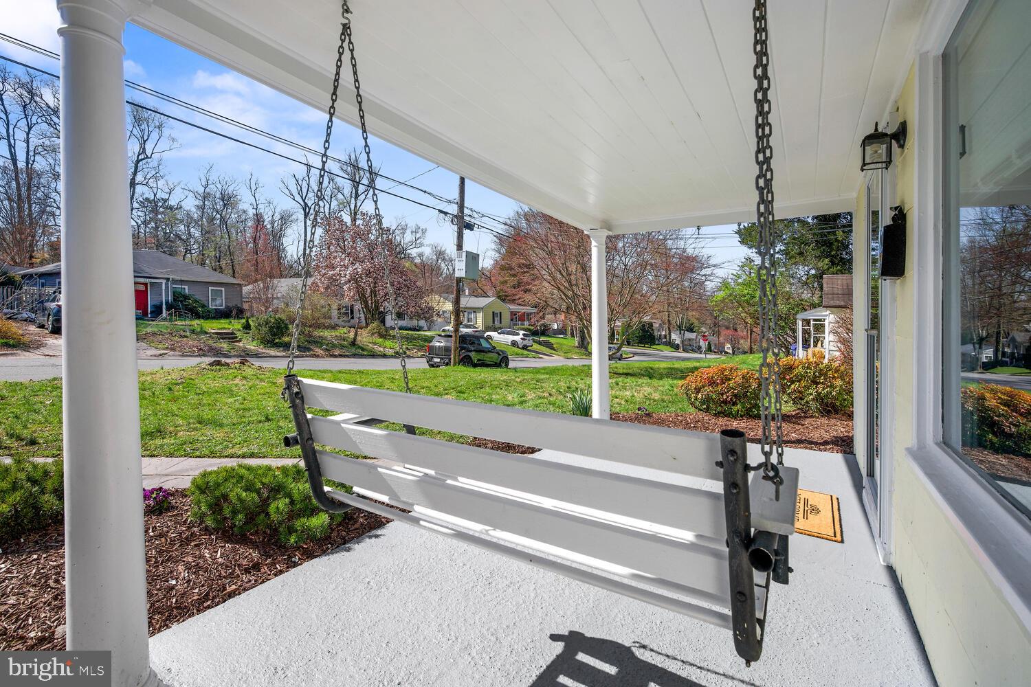 Newly paved front porch with swing