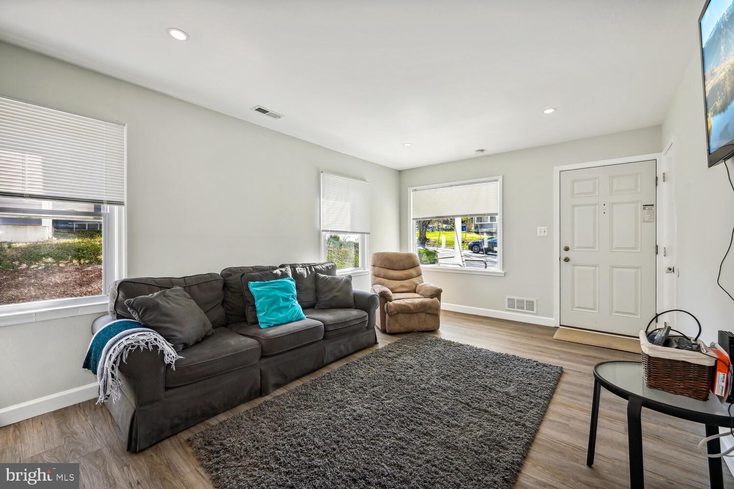 Sun filled living room with luxury vinyl floors