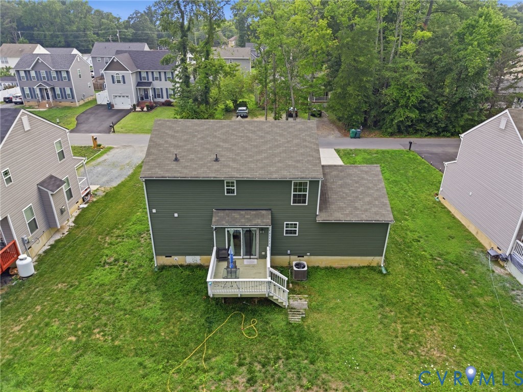 10155 Virginia Road Glen Allen, VA 23060 - Photo 7 of 50 Rear exterior featuring dark green siding, a light
