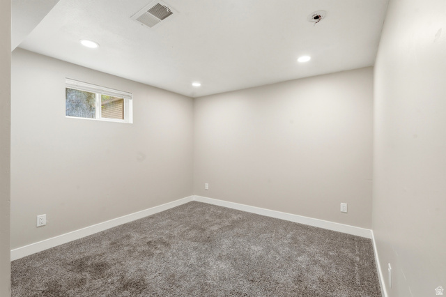 778 East 200 North Logan, UT 84321 - Photo 16 of 43 Carpeted room featuring light gray walls, recessed lighting, and a white-framed window
