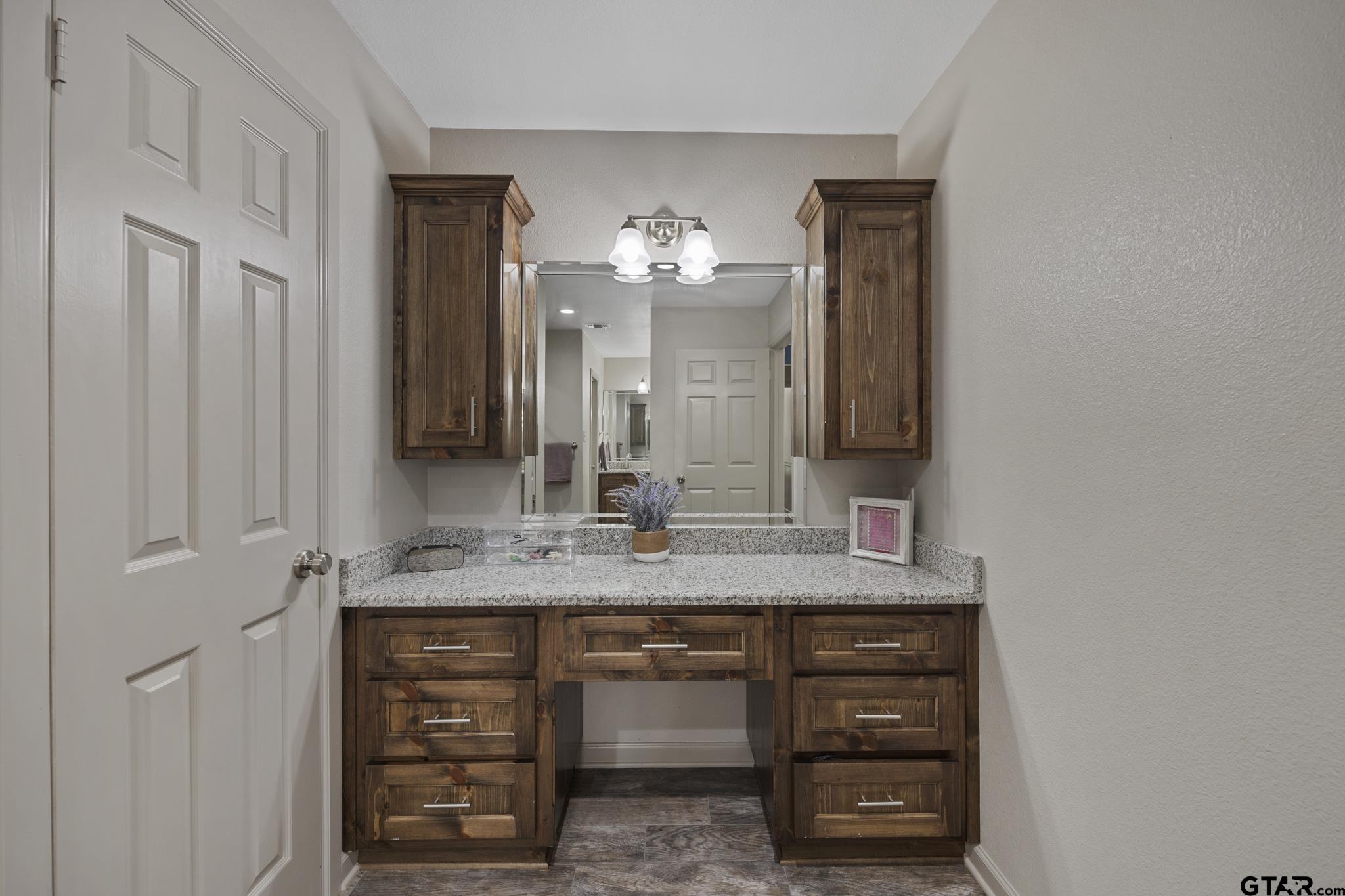 2201 Ridgley Tyler, TX 75703 - Photo 25 of 42 a bathroom with a granite countertop sink and a mirror