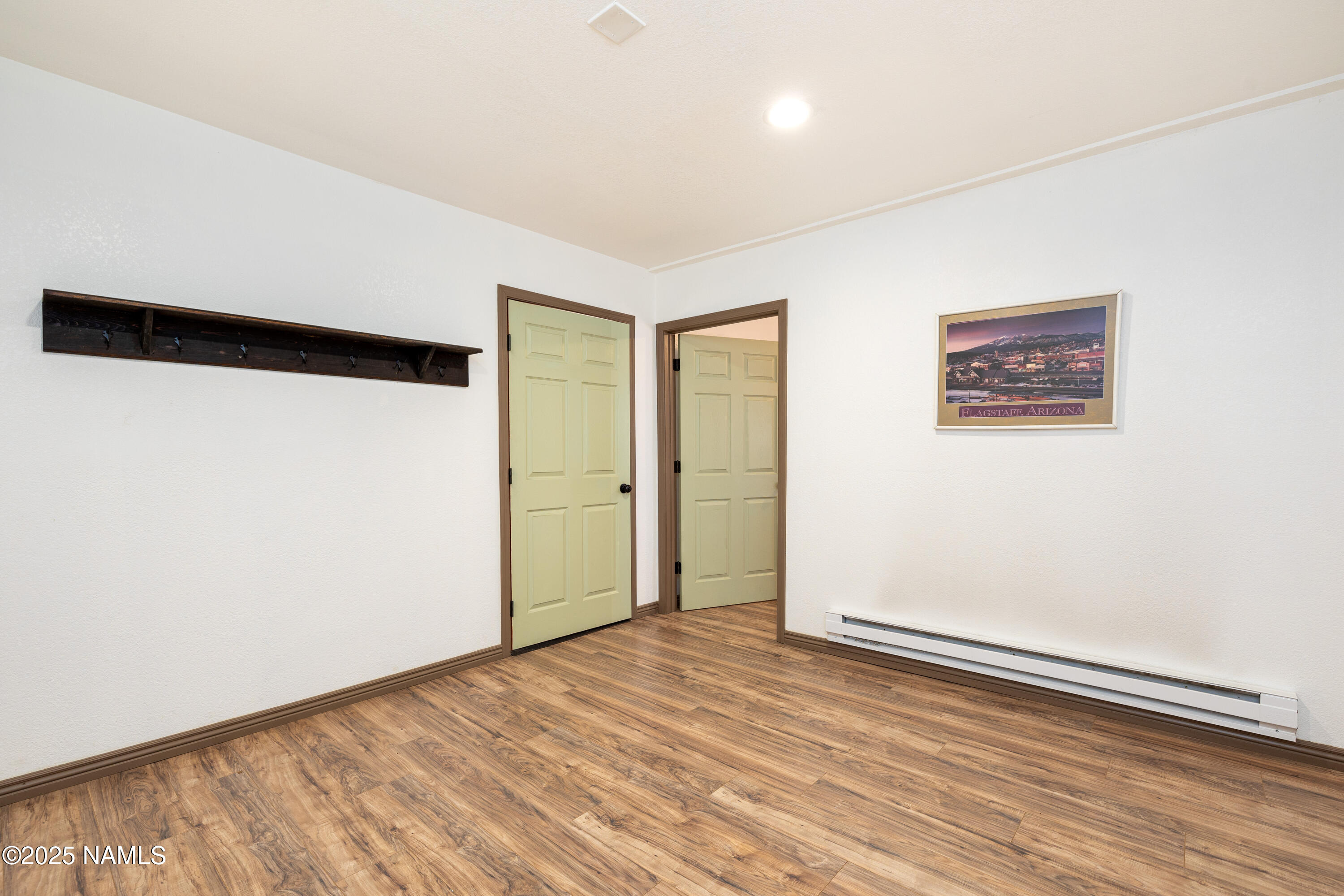 5966 East Camden Road Flagstaff, AZ 86004 - Photo 14 of 70 an empty room with wooden floor